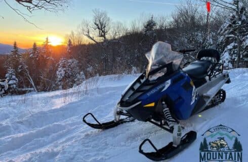 riderless snowmobile on snow